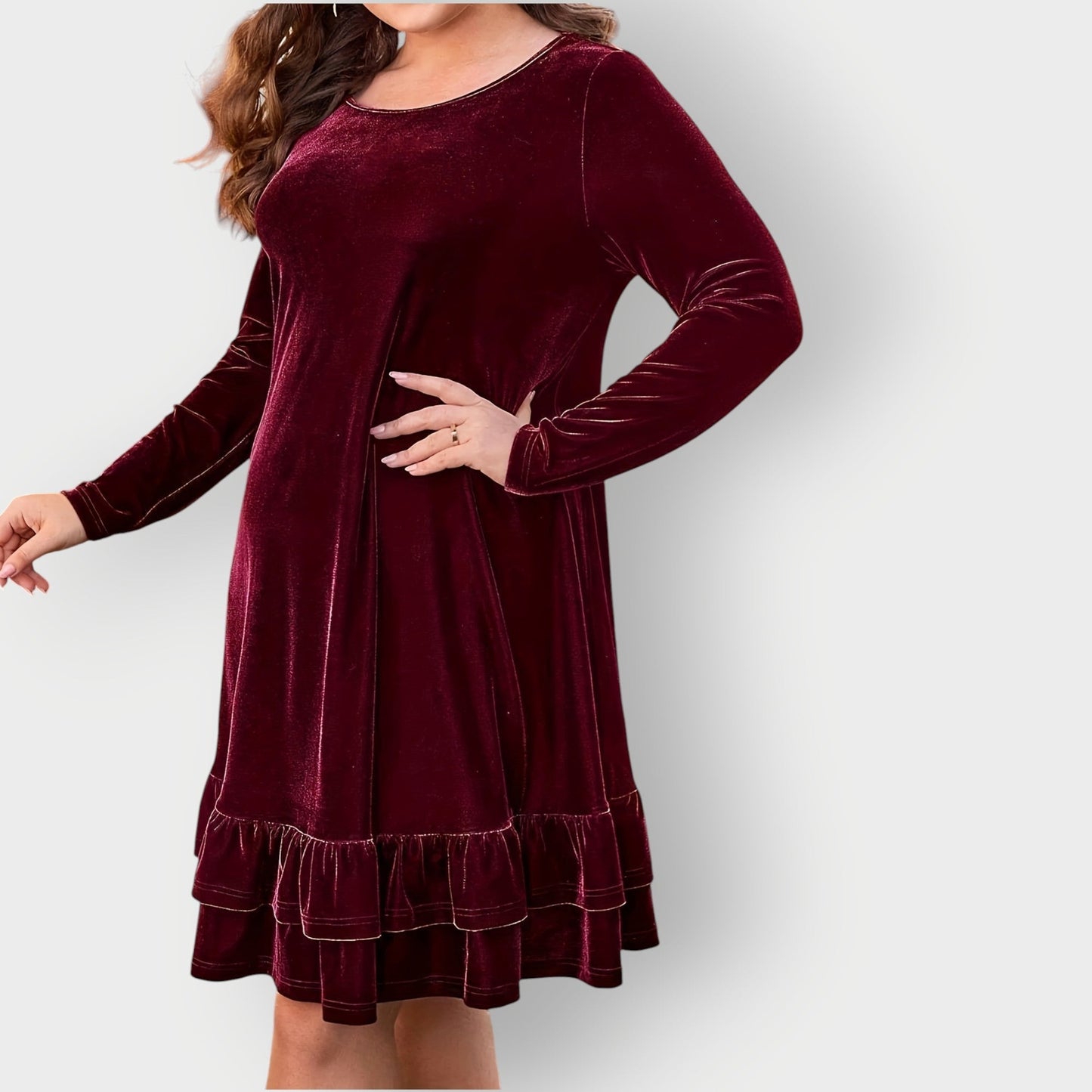 Red - Woman wearing a solid long sleeve velvet A-line dress featuring a double tiered ruffle hem