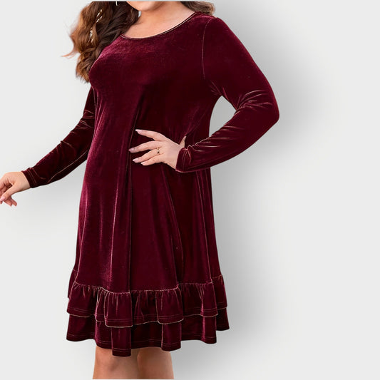 Red - Woman wearing a solid long sleeve velvet A-line dress featuring a double tiered ruffle hem