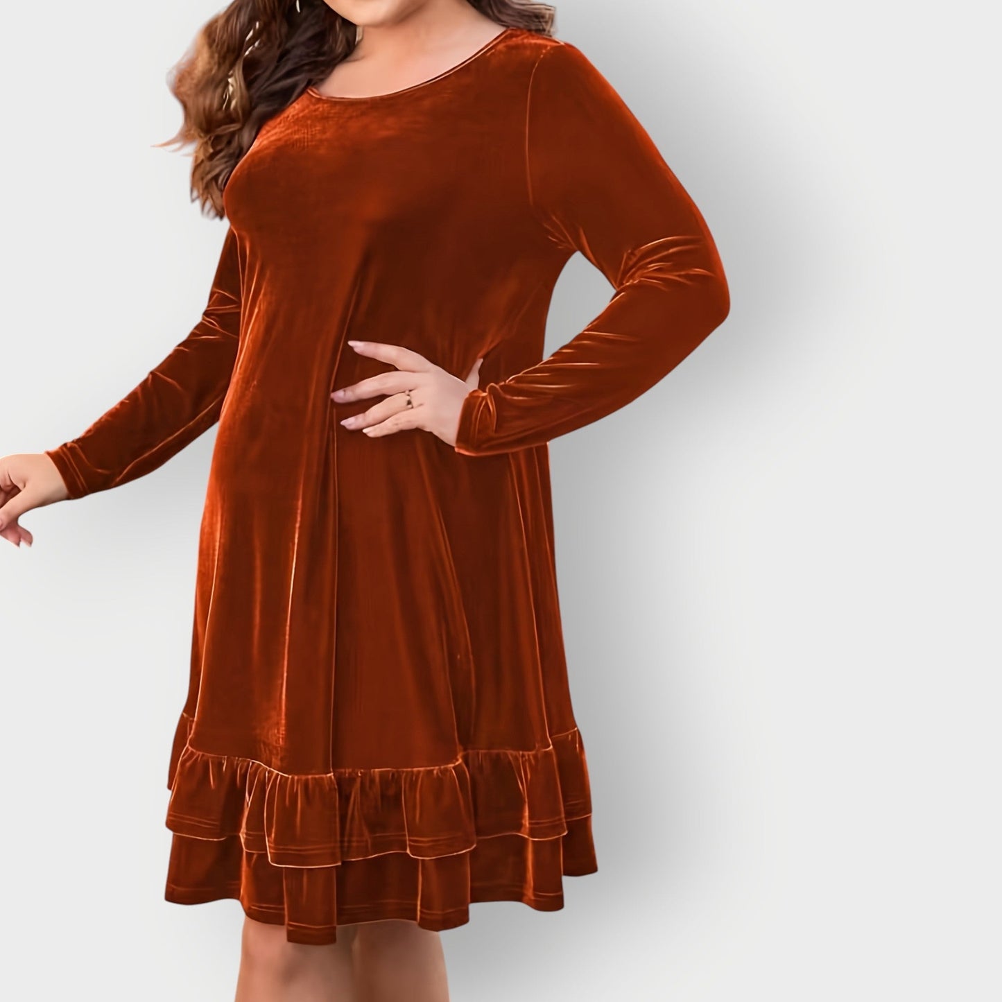 Bronze - Woman wearing a solid long sleeve velvet A-line dress featuring a double tiered ruffle hem