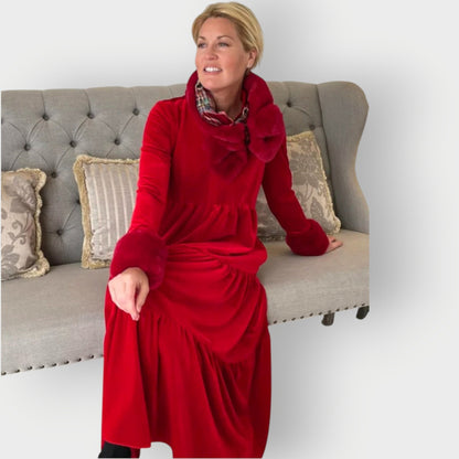 Red - Woman wearing a solid colour velvet long sleeve tiered maxi dress with a stand collar