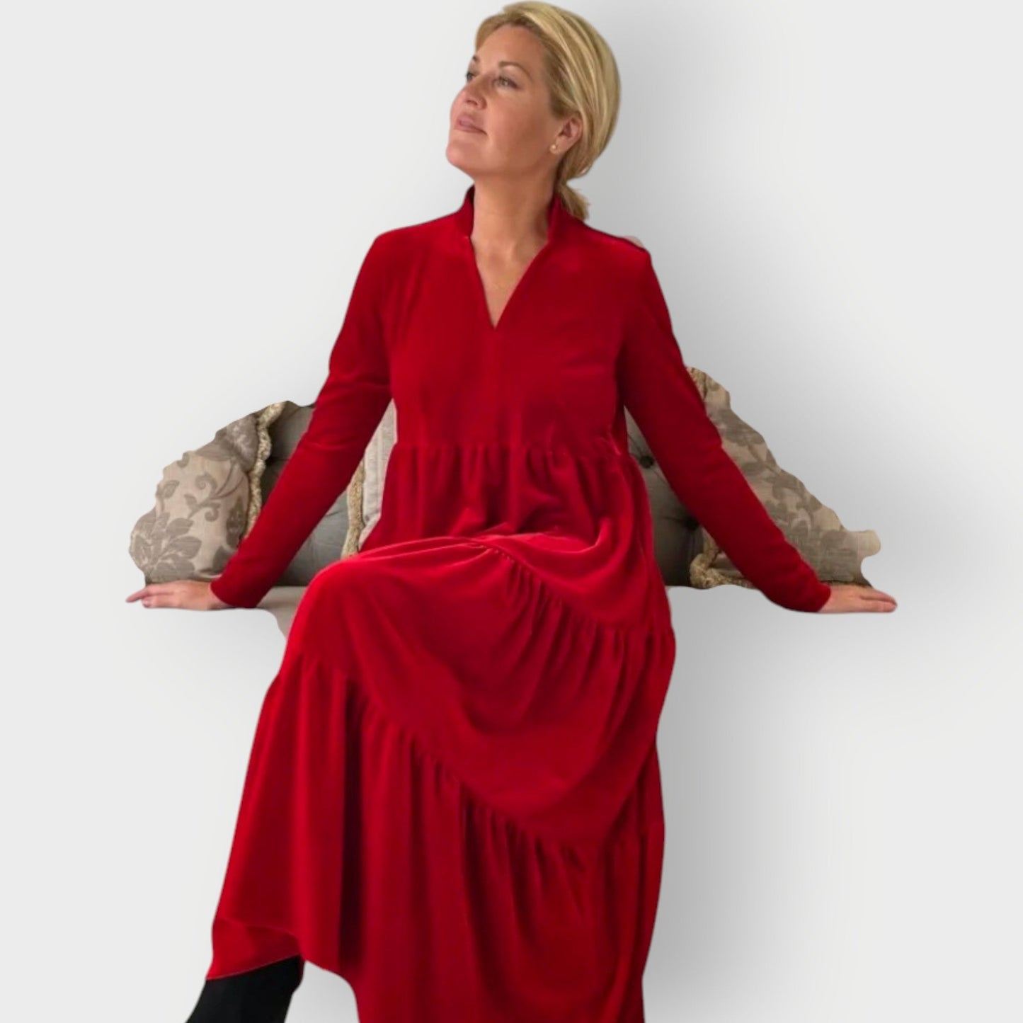 Red - Woman wearing a solid colour velvet long sleeve tiered maxi dress with a stand collar