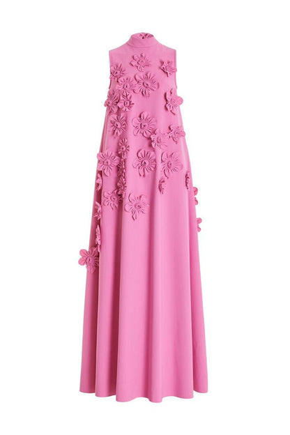 Woman in pink crepe gown with 3D floral appliques