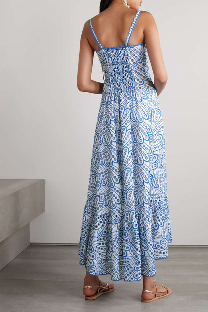 Woman in blue and white embroidered cotton maxi dress