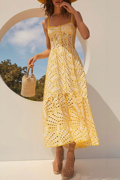 Woman in blue and white embroidered cotton maxi dress
