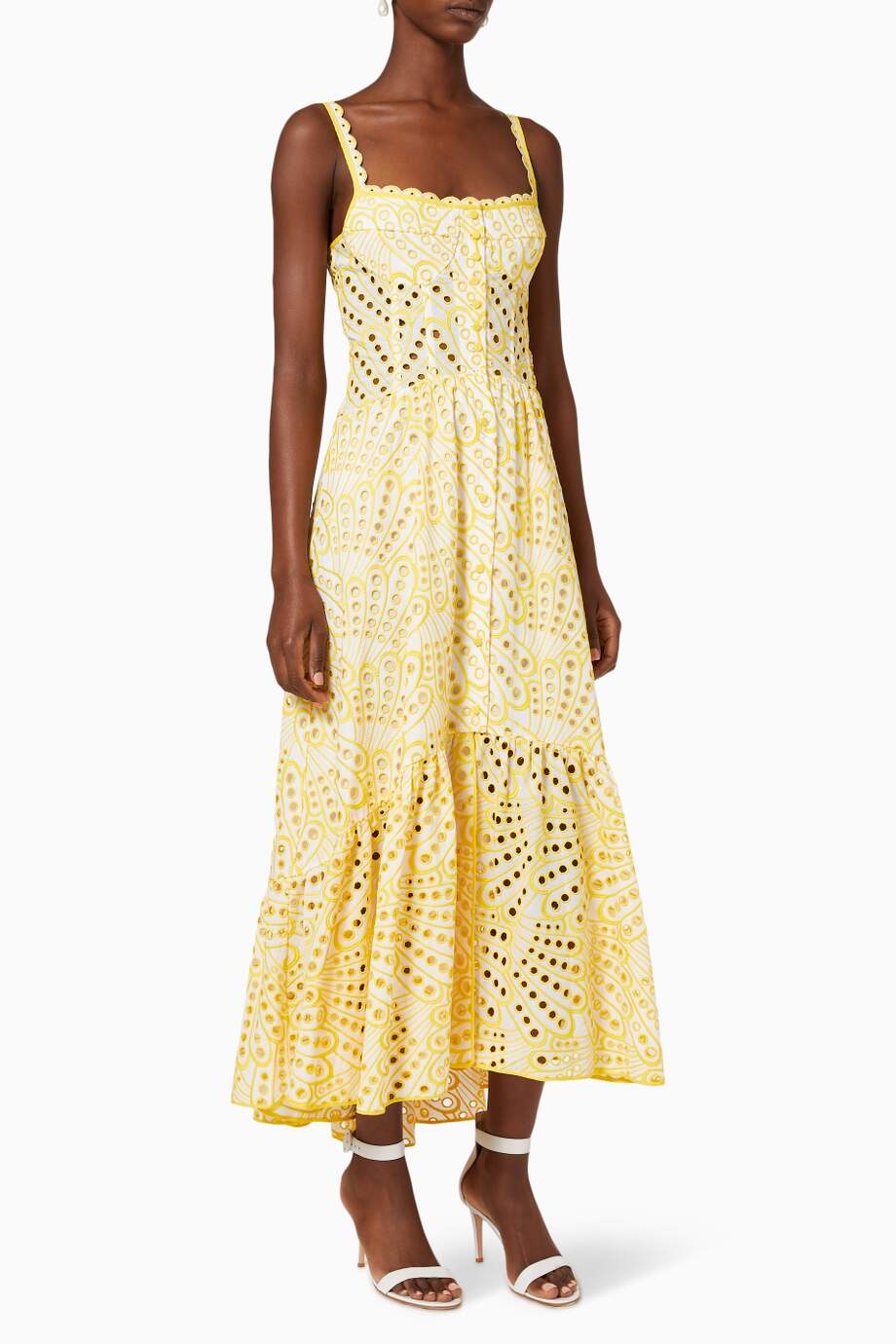 Woman in blue and white embroidered cotton maxi dress