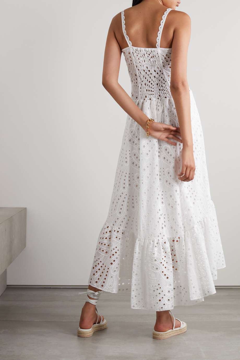 Woman in blue and white embroidered cotton maxi dress