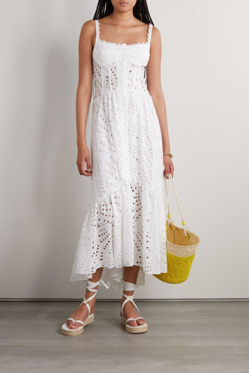 Woman in blue and white embroidered cotton maxi dress