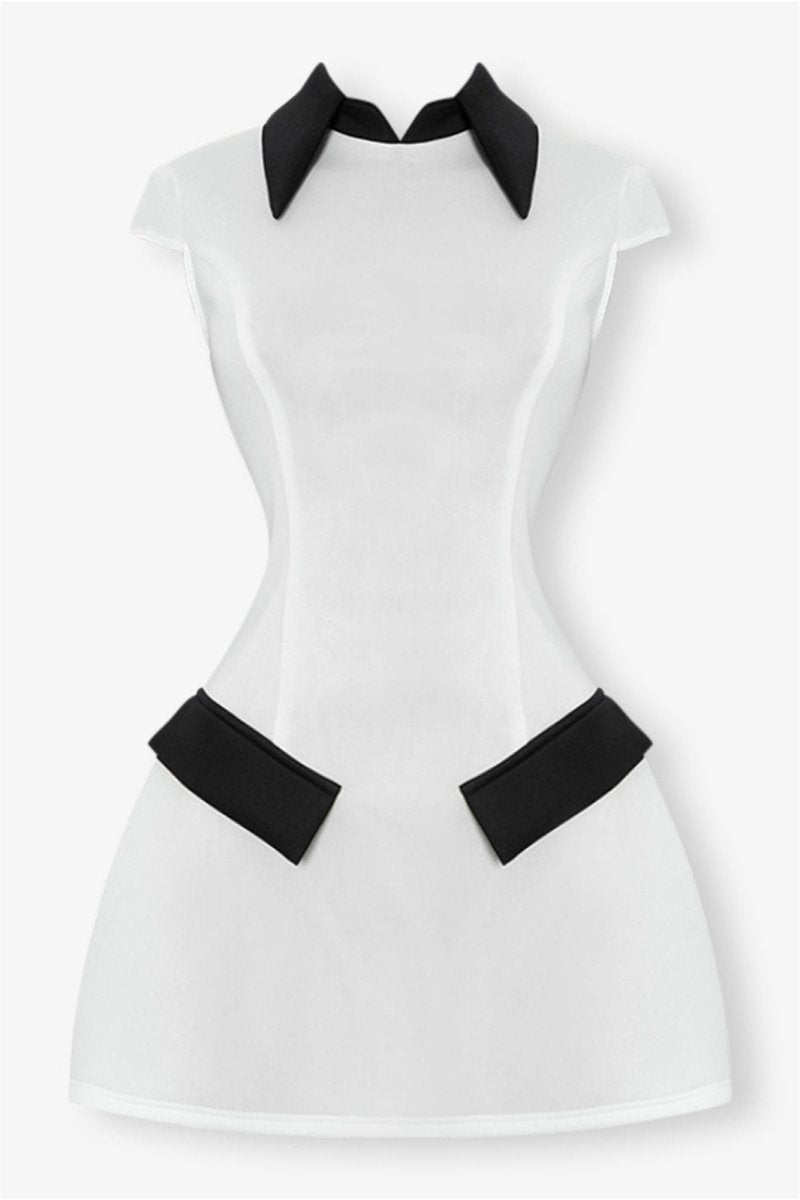 Woman in white mini dress with black collar and pockets