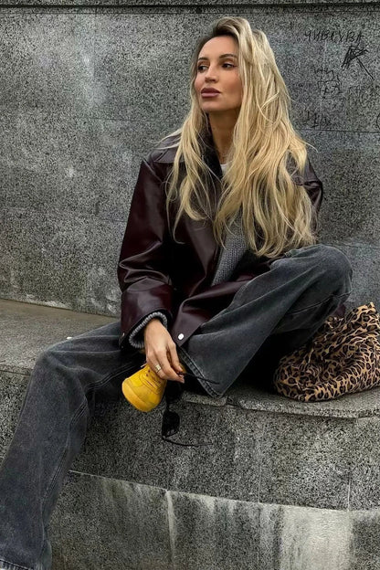 Amaranth - Women's deep burgundy faux leather zip-front cropped bomber jacket with a wide collar, styled over a black top and dark denim.