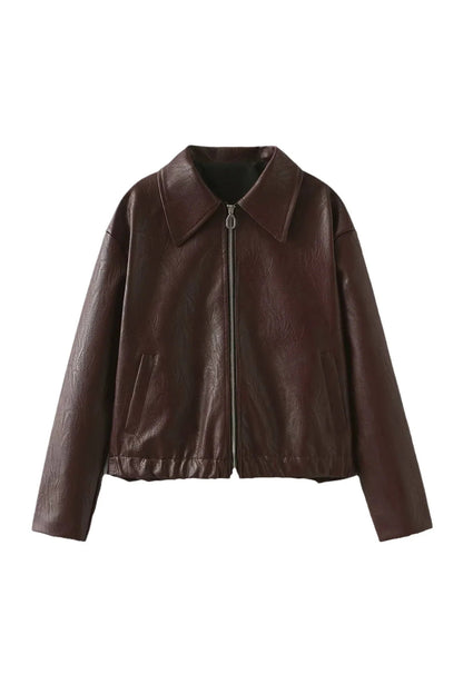 Amaranth - Women's deep burgundy faux leather zip-front cropped bomber jacket with a wide collar, styled over a black top and dark denim.